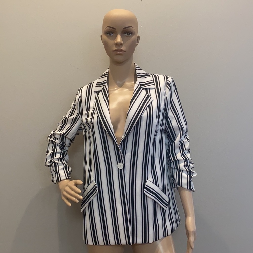 Black and white striped blazer with ruched sleeves.